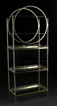 S4E02 - Paranormal Parentage: Pierce Hawthorne's (as portrayed by Chevy Chase) Etagere Shelf